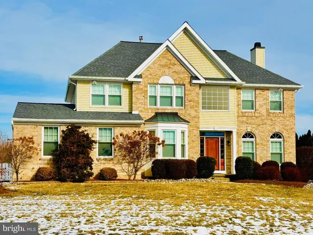 a view of a house with swimming pool and front view of a house