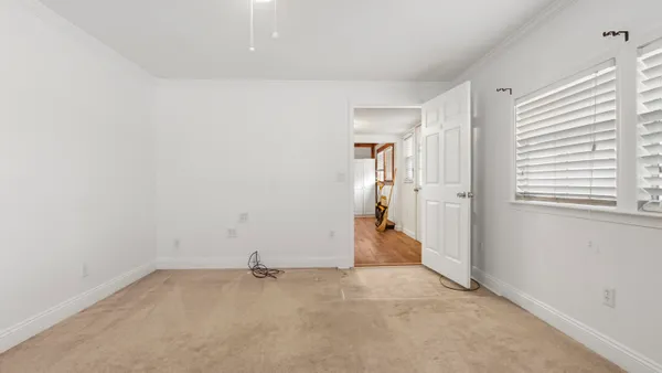 a view of a kitchen with wooden floor