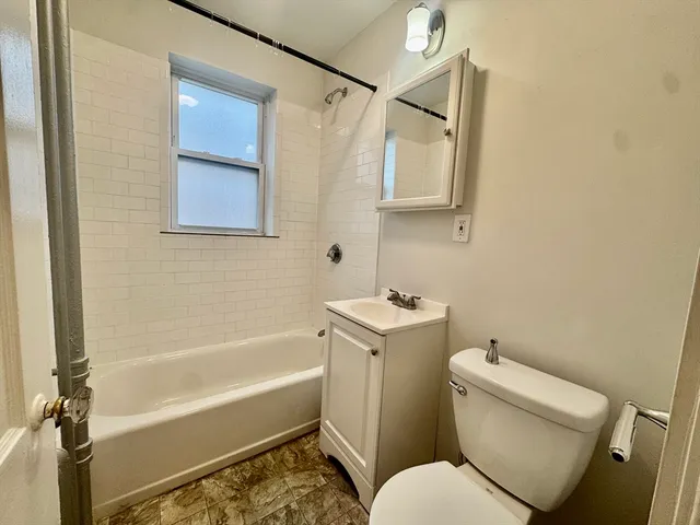 a bathroom with a toilet sink and bathtub