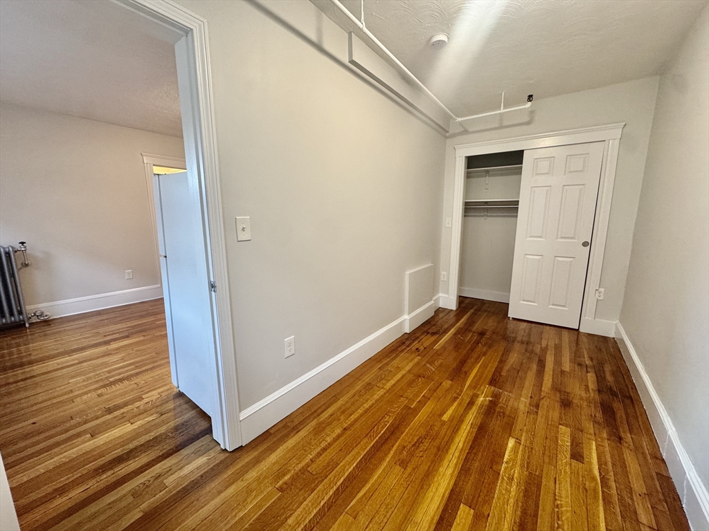 1615 Commonwealth Avenue, Unit 27 Boston, MA 02135 - Photo 8 of 10 a view of a room with wooden floor