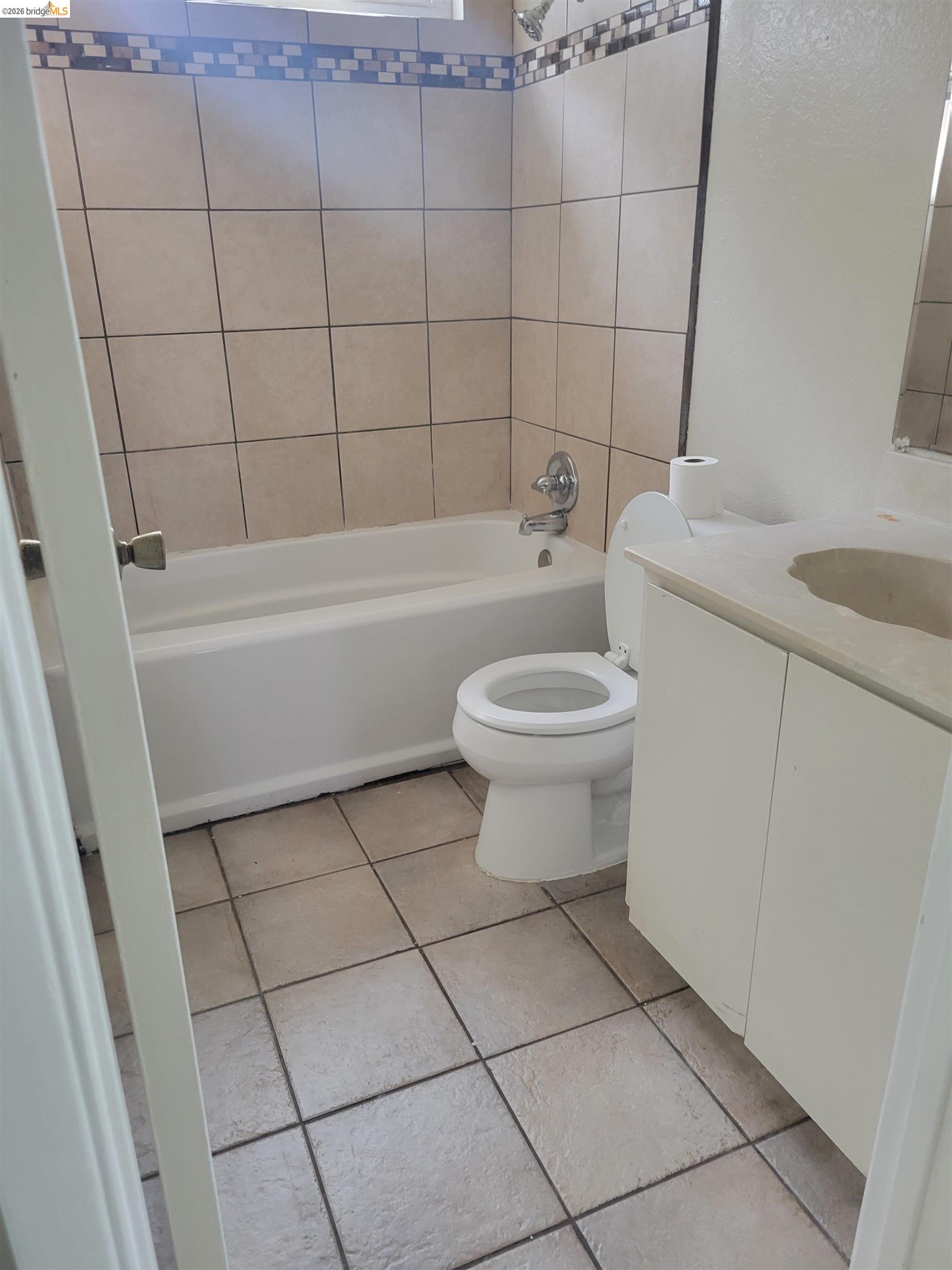 906 Coral Drive Rodeo, CA 94572 - Photo 13 of 21 a bathroom with a bathtub and toilet