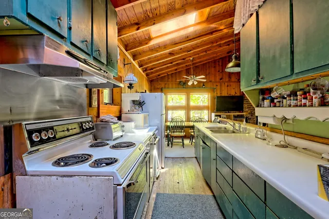a living room with lots of furniture and a chandelier
