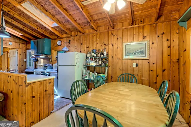 a bedroom with a bed a table and chair