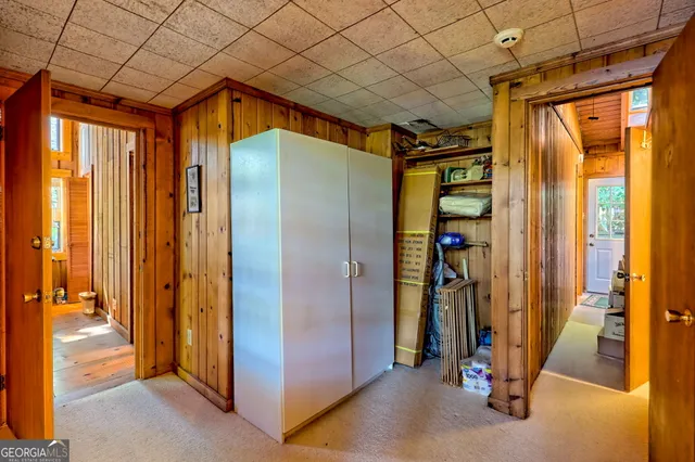 a bedroom with double bed and a window