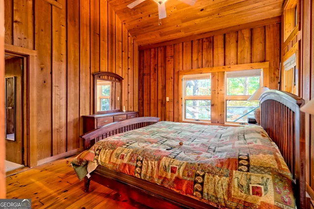 a dining room with furniture window and wooden floor