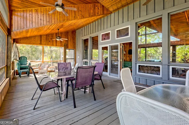 a view of a building with a large window and yard