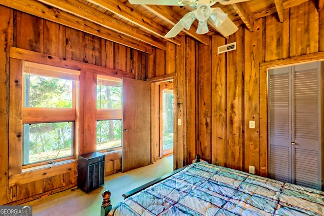 a view of a house with backyard and balcony