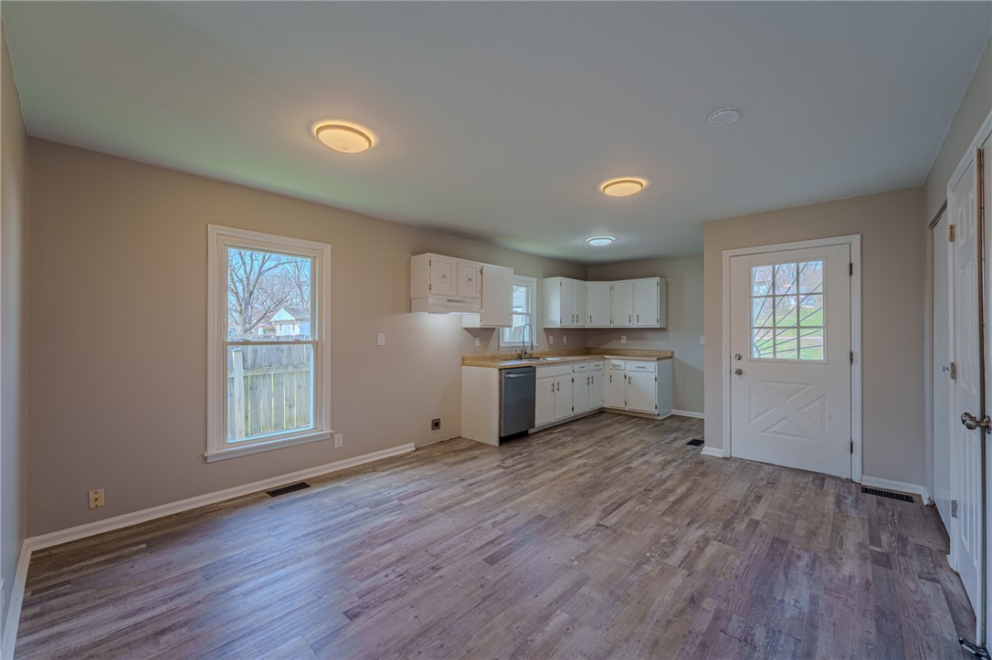 1005 Burt Street Springfield, OH 45505 - Photo 10 of 33 This bright kitchen and dining area features durable flooring and ample cabinet space.