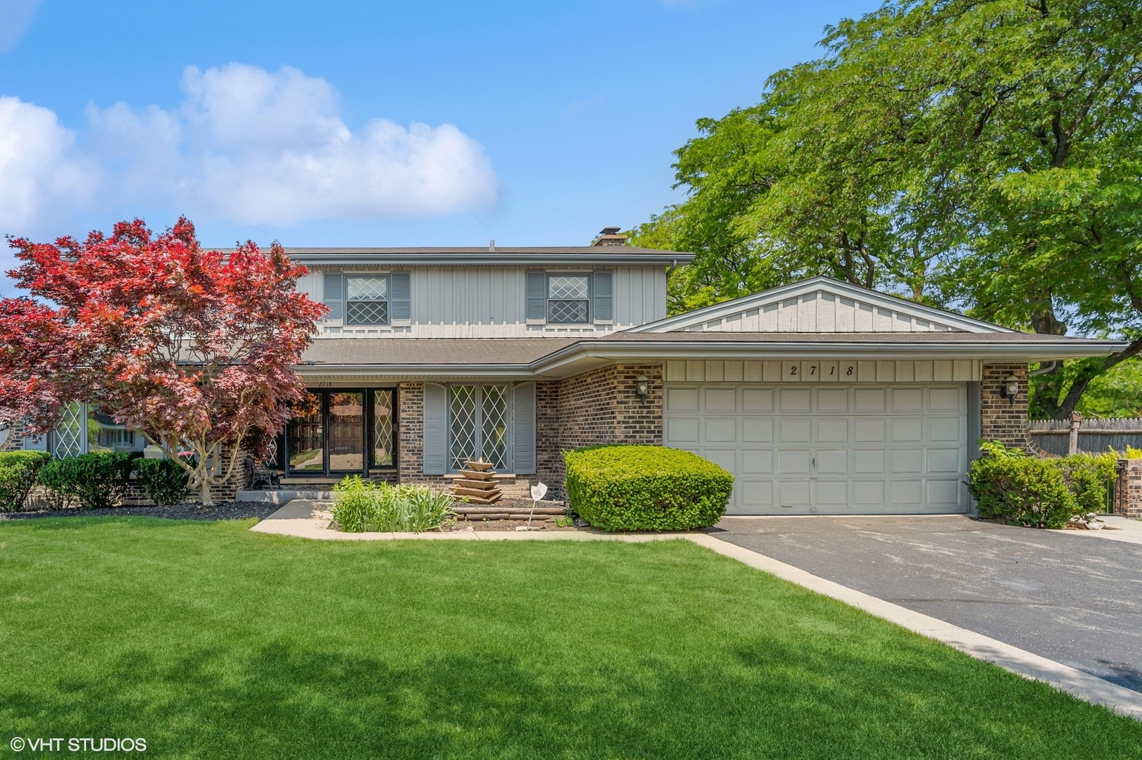 2718 Covert Road Glenview, IL 60025 - Photo 1 of 1 a front view of a house with a garden and trees