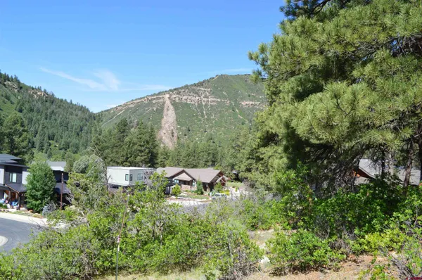 an aerial view of a house with mountain view