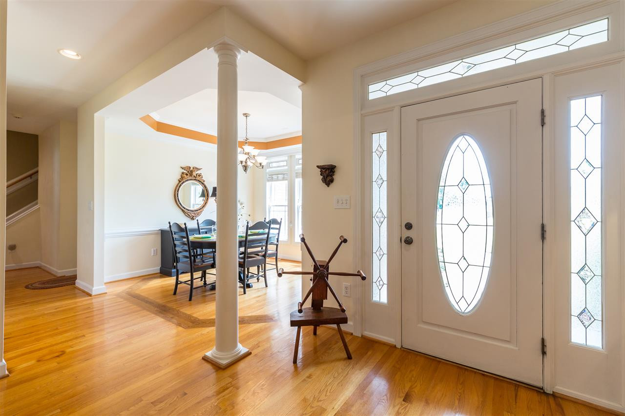 1013 Bellewood Farms Road Raleigh, NC 27603 - Photo 3 of 25 The sunny, open entry way offers unique details, moldings, and columns. Entry