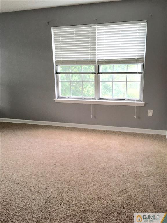 313 Wimbeldon Court North Brunswick, NJ 08902 - Photo 12 of 17 an empty room with a window