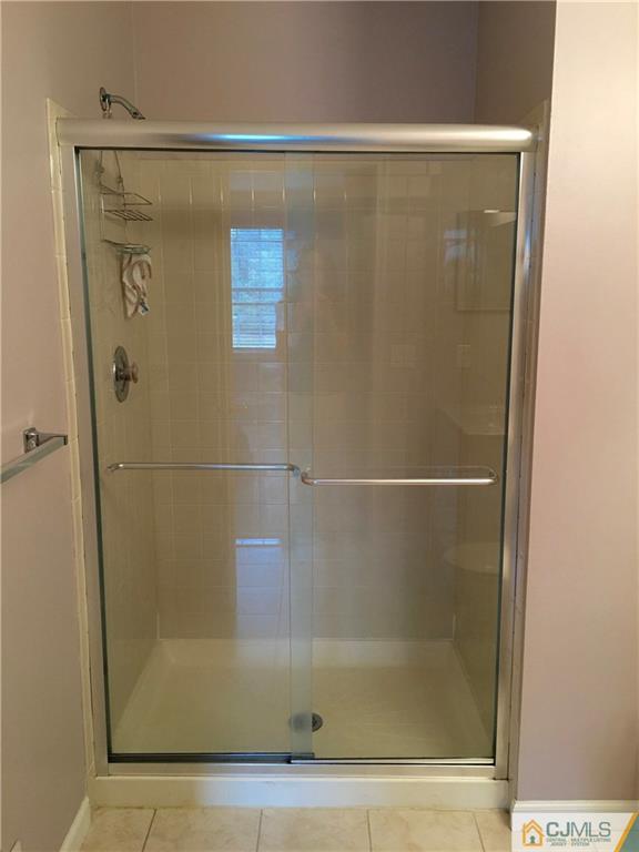 313 Wimbeldon Court North Brunswick, NJ 08902 - Photo 16 of 17 a bathroom with a shower