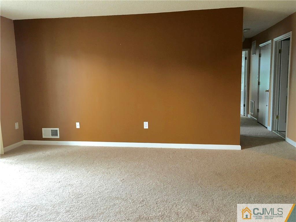 313 Wimbeldon Court North Brunswick, NJ 08902 - Photo 3 of 17 a view of an empty room
