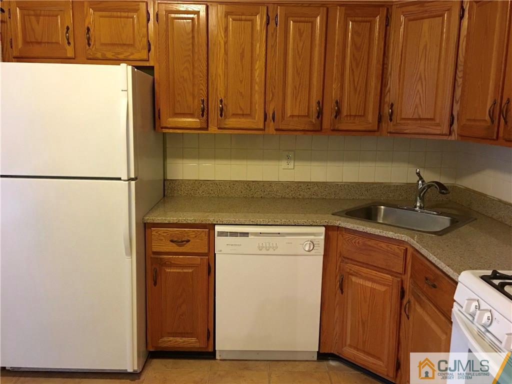 313 Wimbeldon Court North Brunswick, NJ 08902 - Photo 7 of 17 a utility room with dryer and washer