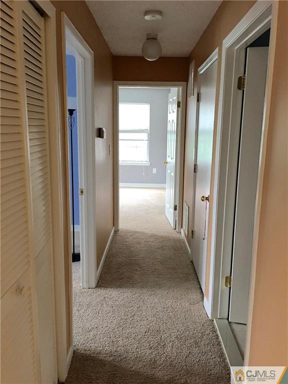 313 Wimbeldon Court North Brunswick, NJ 08902 - Photo 9 of 17 a view of gallery with door