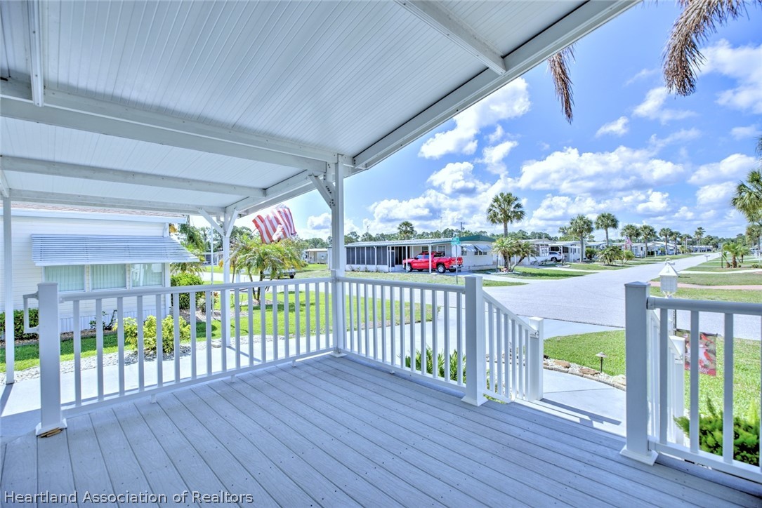 2702 Rodney Street Sebring, FL 33872 - Photo 20 of 33 a view of a porch with wooden floor and outdoor space
