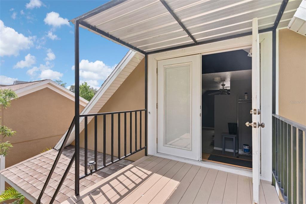 12136 McIntosh Road Thonotosassa, FL 33592 - Photo 26 of 44 a view of a balcony with wooden floor