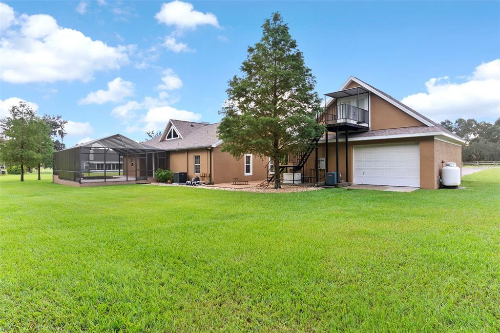 12136 McIntosh Road Thonotosassa, FL 33592 - Photo 30 of 44 a front view of house with yard and seating area
