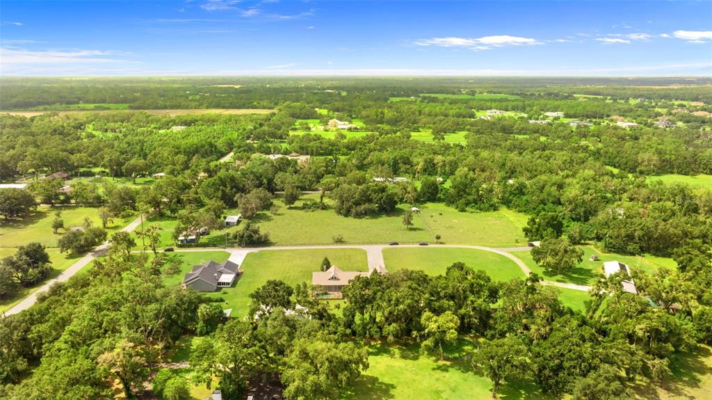 12136 McIntosh Road Thonotosassa, FL 33592 - Photo 41 of 44 a view of an outdoor space and a lake view
