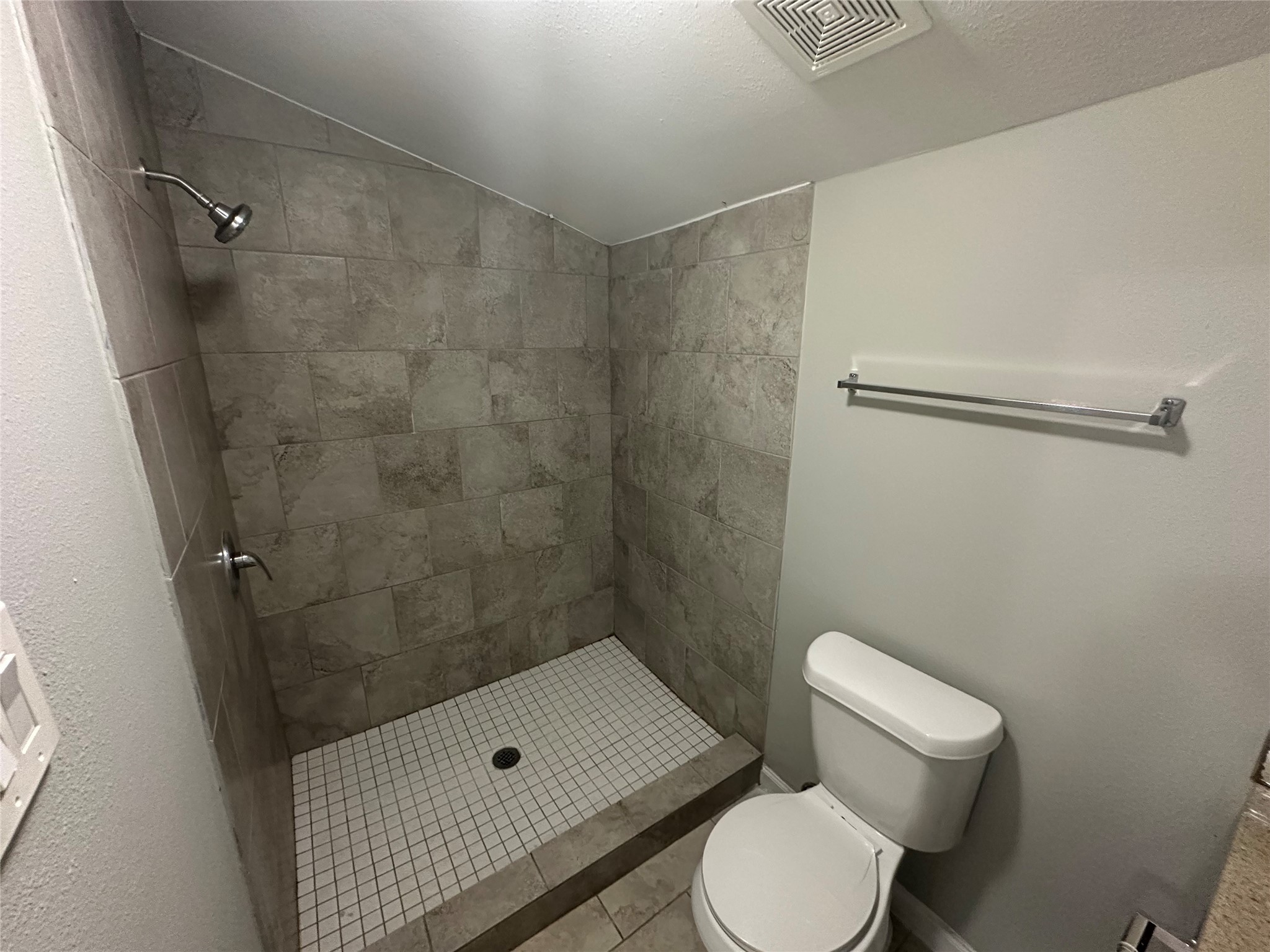 107 Altic Street, Unit 3 Houston, TX 77011 - Photo 11 of 13 a bathroom with a toilet and a shower