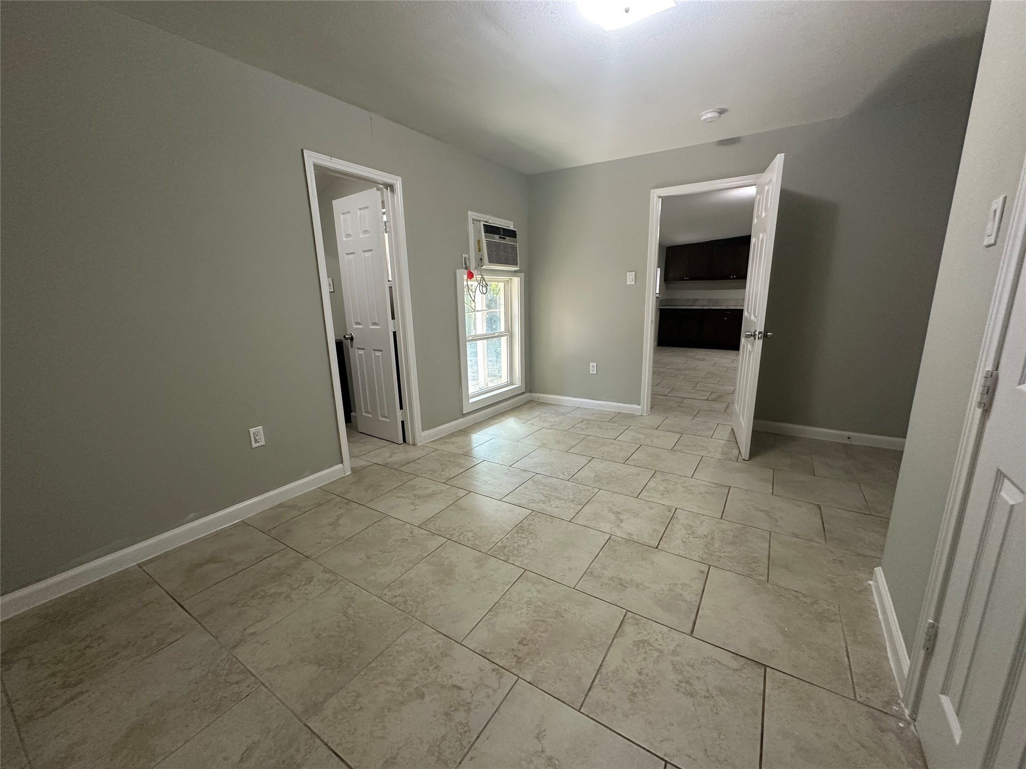 107 Altic Street, Unit 3 Houston, TX 77011 - Photo 8 of 13 an empty room with kitchen and entrance