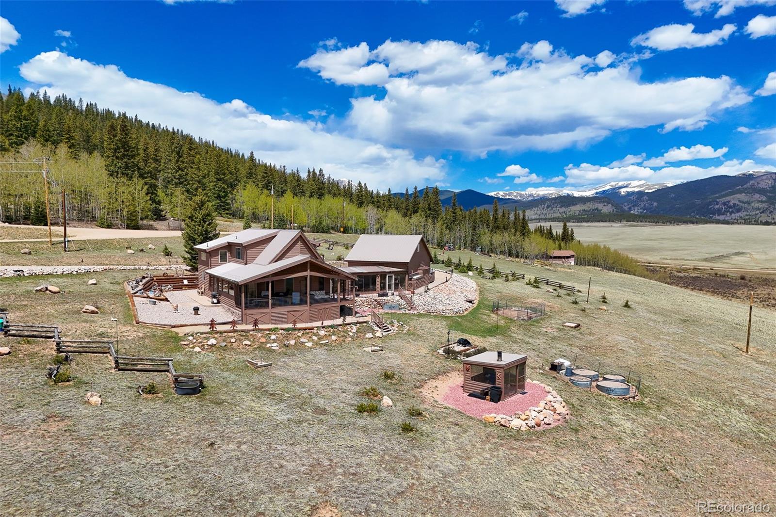 1163 Michigan Hill Road Jefferson, CO 80456 - Photo 2 of 48 a view of a lake with houses