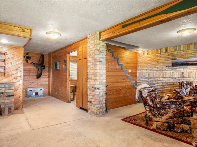 371 Lewis Loop, Unit 29 Fish Haven, ID 83287 - Photo 36 of 40 Recreational space featuring extensive wood paneling and exposed brickwork
