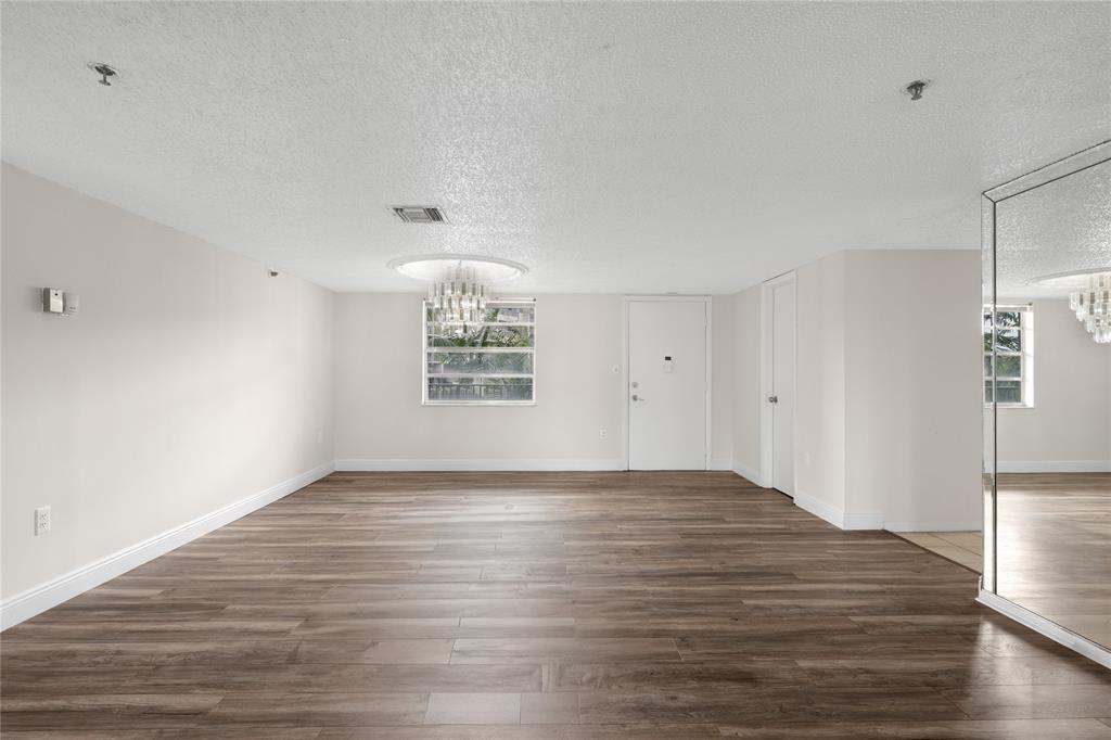 3940 Inverrary Boulevard, Unit 404 Fort Lauderdale, FL 33319 - Photo 3 of 36 Large Living Room/Dining Room Area