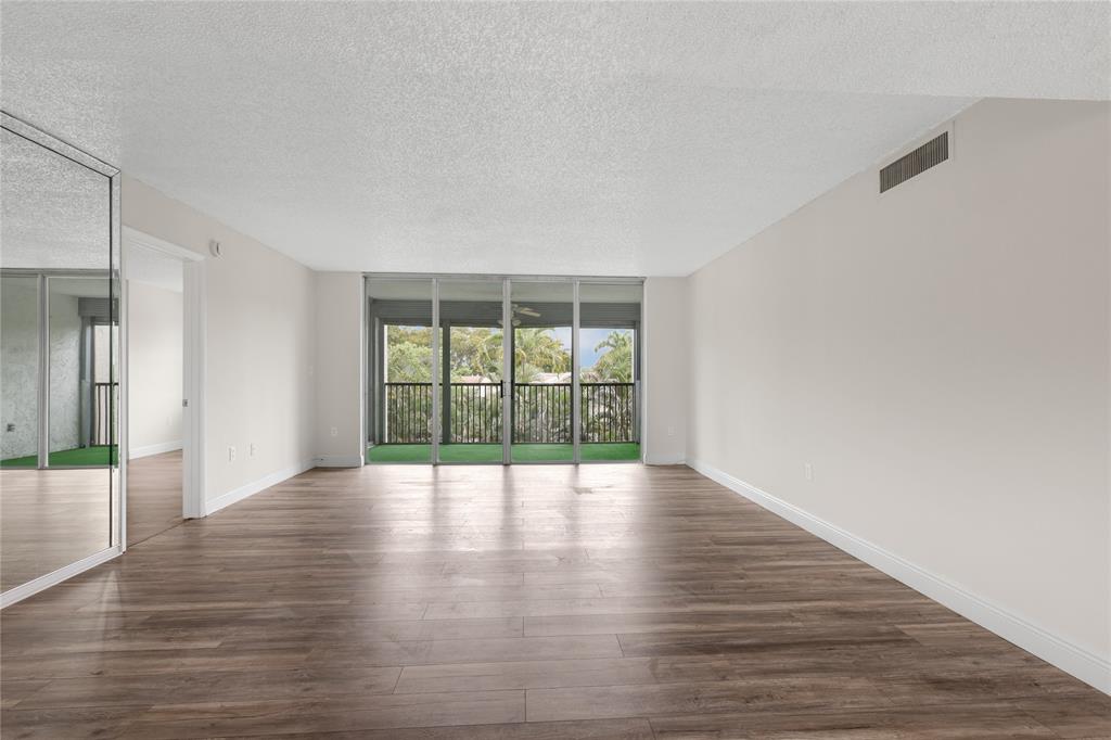 3940 Inverrary Boulevard, Unit 404 Fort Lauderdale, FL 33319 - Photo 4 of 36 Large Living Room/Dining Room Area