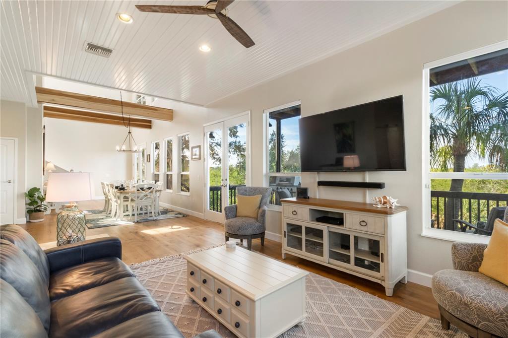 7325 Holly Road Terra Ceia, FL 34250 - Photo 14 of 87 a living room with furniture and a flat screen tv