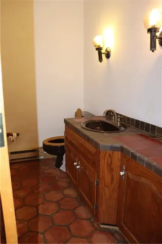 a room with a bed and a cabinets