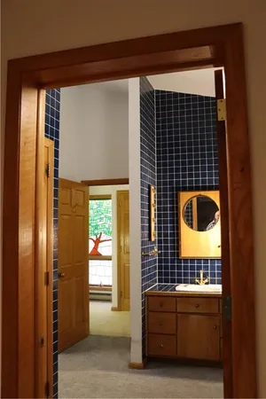 a bathroom with a tub and a window
