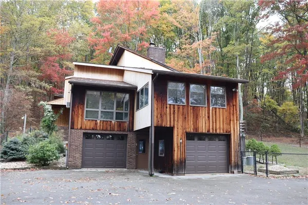 a front view of a house with a garage