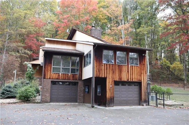 a front view of a house with a garage