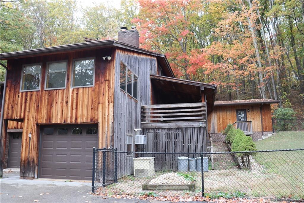 232 Red Arrow Road Ligonier, PA 15658 - Photo 5 of 47 a backyard of a house with seating space