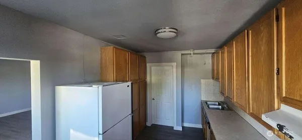 a view of a livingroom with wooden floor