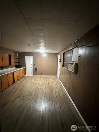 a room with furniture and a wooden floor