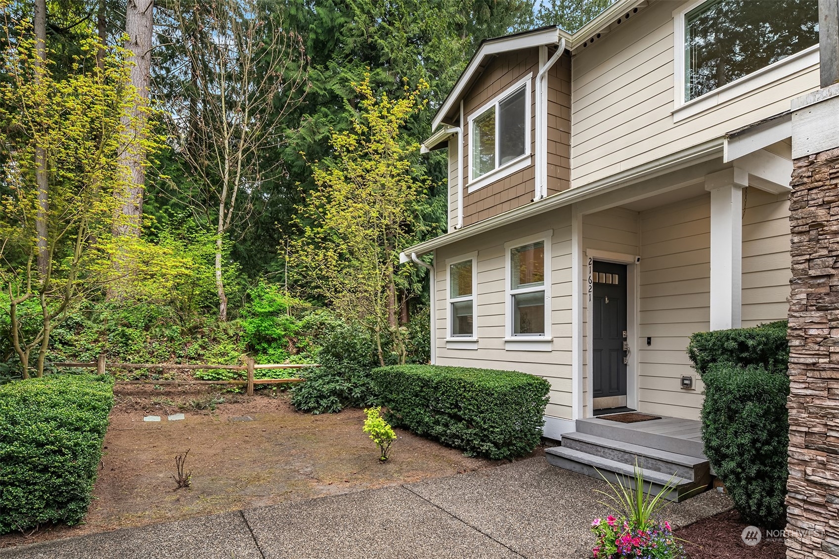 21621 11th Drive Southeast Bothell, WA 98021 - Photo 1 of 31 a front view of a house with garden