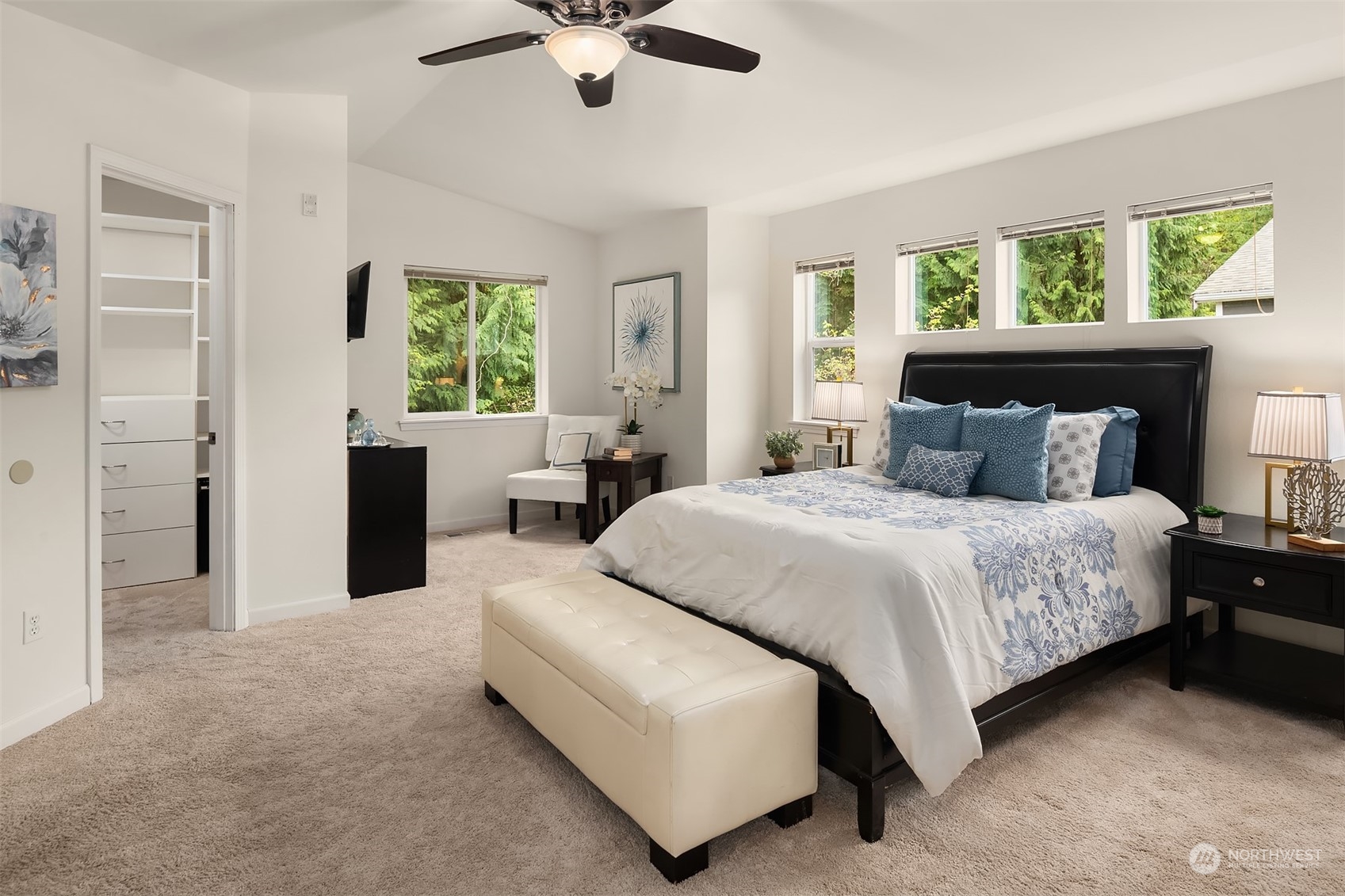 21621 11th Drive Southeast Bothell, WA 98021 - Photo 15 of 31 a bedroom with a large bed and a chandelier fan