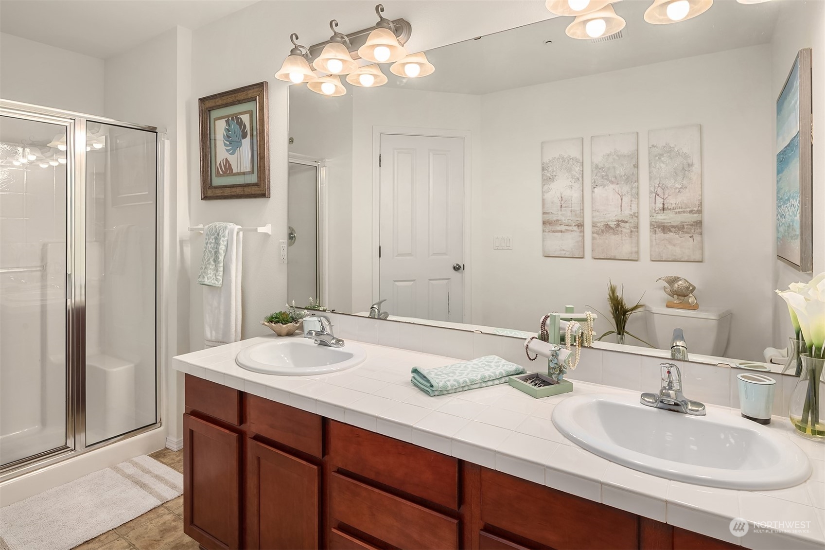 21621 11th Drive Southeast Bothell, WA 98021 - Photo 17 of 31 a bathroom with a sink double vanity and a mirror