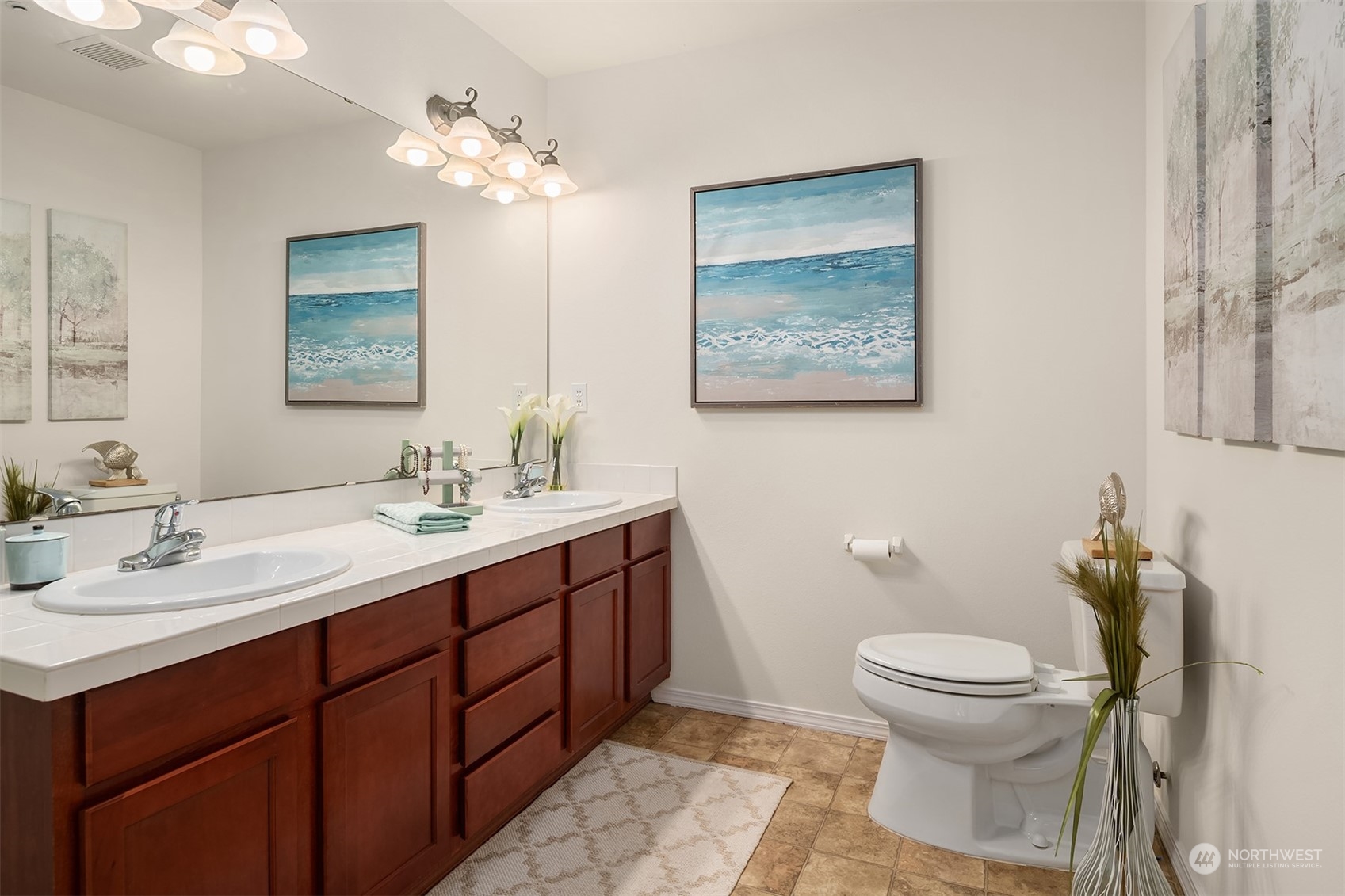 21621 11th Drive Southeast Bothell, WA 98021 - Photo 18 of 31 a bathroom with a toilet sink and mirror
