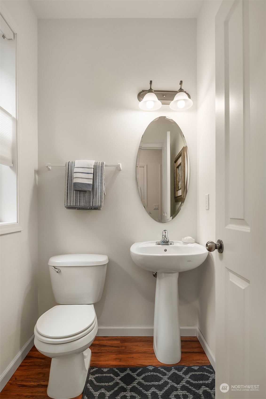 21621 11th Drive Southeast Bothell, WA 98021 - Photo 22 of 31 a bathroom with a toilet sink and mirror