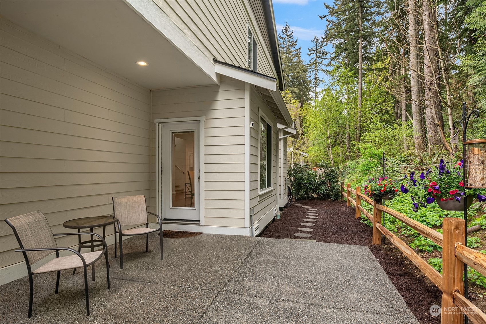 21621 11th Drive Southeast Bothell, WA 98021 - Photo 23 of 31 a view of a chair and table in backyard of the house