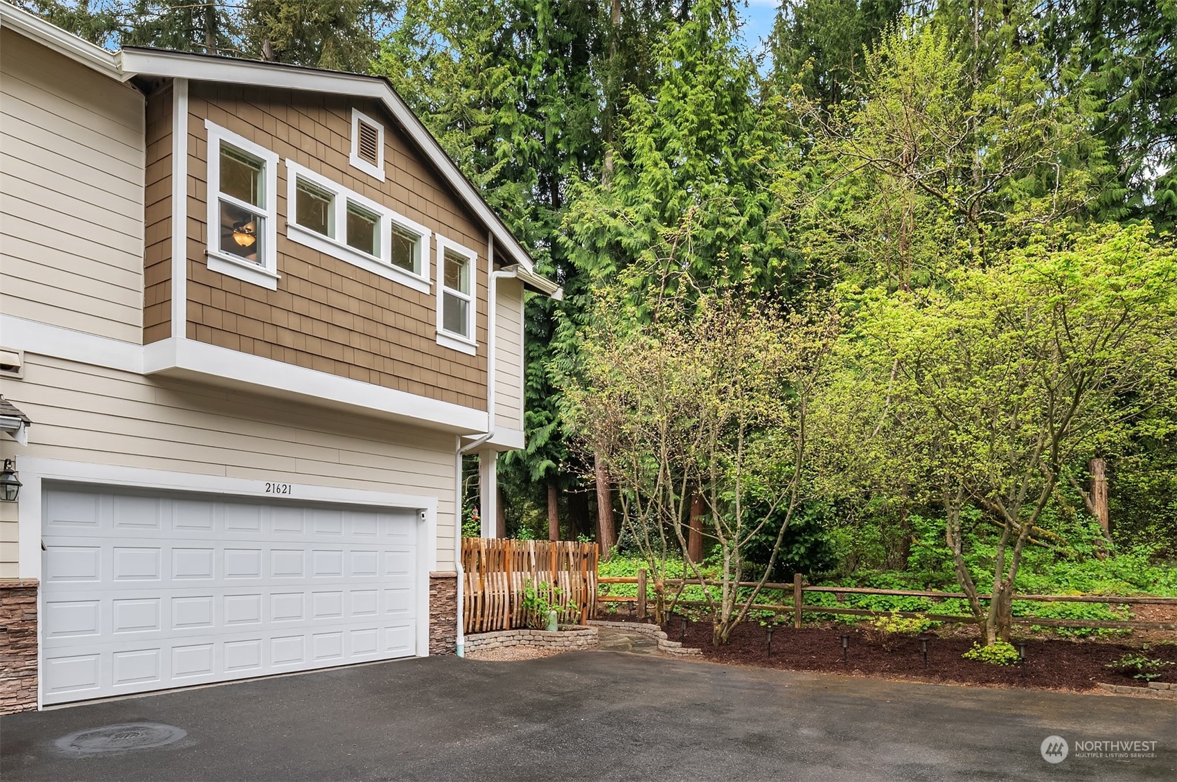 21621 11th Drive Southeast Bothell, WA 98021 - Photo 24 of 31 a front view of a house with a garden