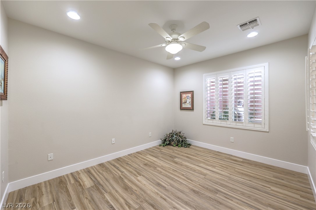 2072 Crown View Street Henderson, NV 89052 - Photo 17 of 53 Den/Office w/ Ceiling Fan, Recessed Lighting, and Laminate Wood Flooring