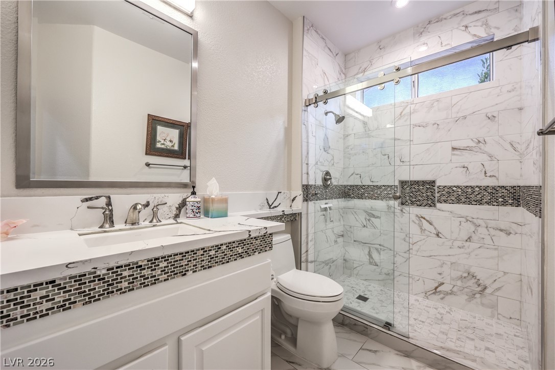 2072 Crown View Street Henderson, NV 89052 - Photo 29 of 53 Secondary Bathroom with Raised Vanity w/ Quartz Countertop, Shower w/ Enclosure, and Tile Flooring