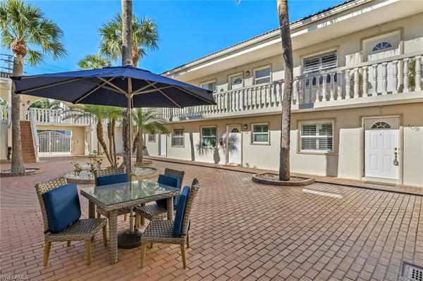 a view of a house with backyard sitting area