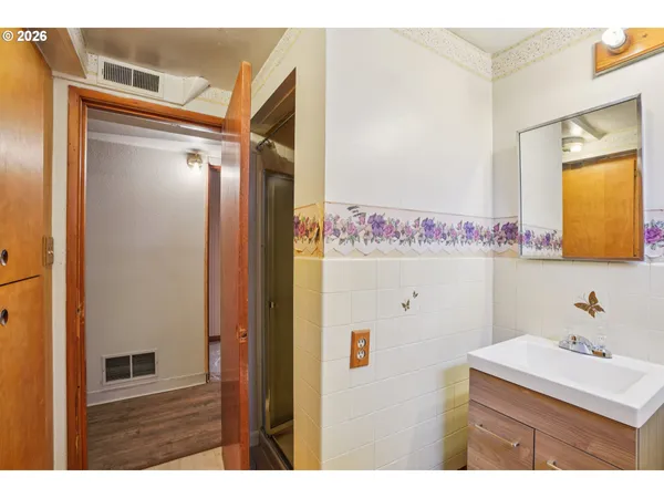 a bathroom with a sink vanity and a mirror