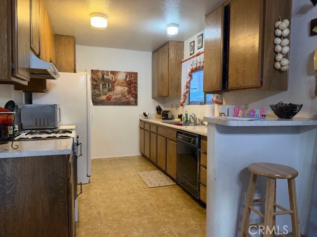 a view of kitchen with furniture and counter space